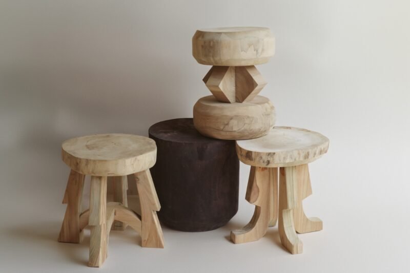 Handcrafted wooden stools and stone stool