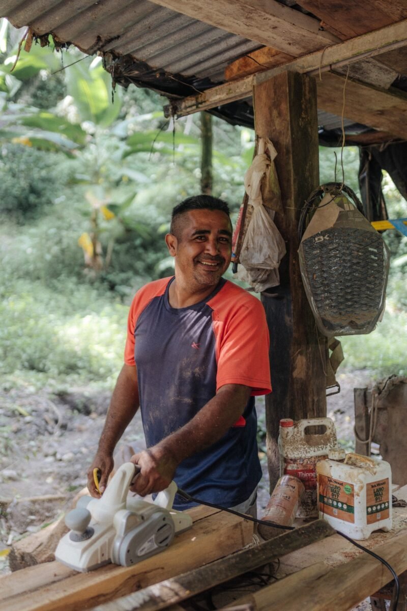 Local craftsman planing wood